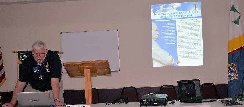 Grand Knight Eddie Williams leads the virtual meething through the praying of the Novena